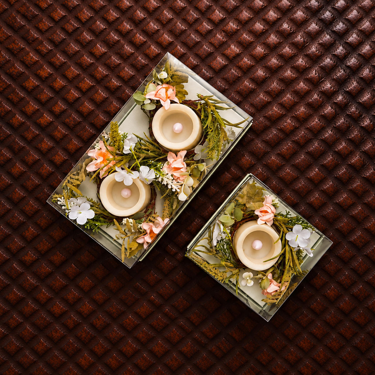 Three Amalfi Candle Rings arranged at different heights on a console table