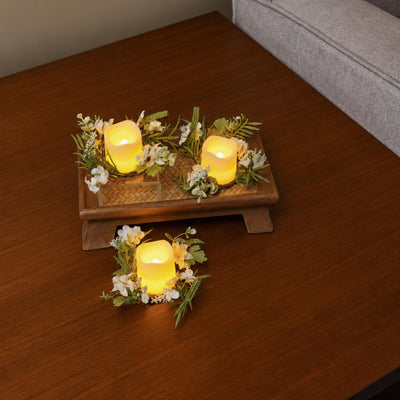 Six Amalfi Candle Rings on clear acrylic risers down the centre of a laid dining table