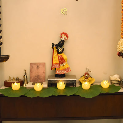 Lotus leaf mats and LED lotus lights in a festive pooja setup