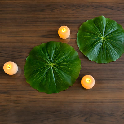 Overhead lotus leaf mats with amber LED candles